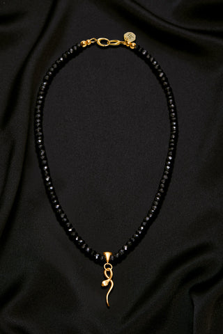 BLACK SPINEL NECKLACE WITH 14K GOLD SNAKE PENDANT