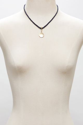NAVY SAPPHIRE NECKLACE WITH 14K GOLD CONCAVE CIRCLE PENDANT